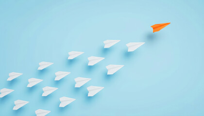 Orange Paper Plane Leading a Group of White Paper Planes for Leadership Concept