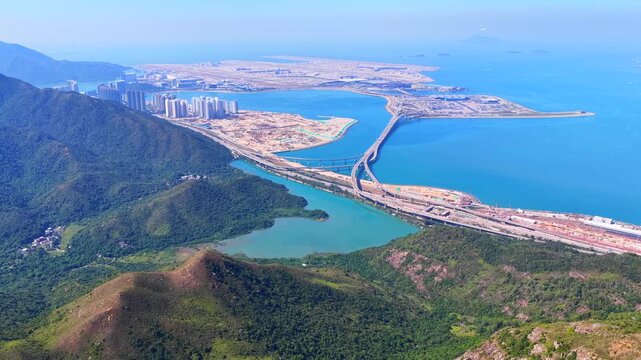 Skyview of lantau island siu ho wan tung chung new town and hong kong zhuhai macau bridge artificial island near chek lap kok airport showcasing greater bay area logistics growth