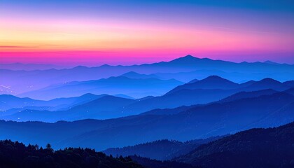 Majestic Mountain Range at Sunrise with Vibrant Sky.