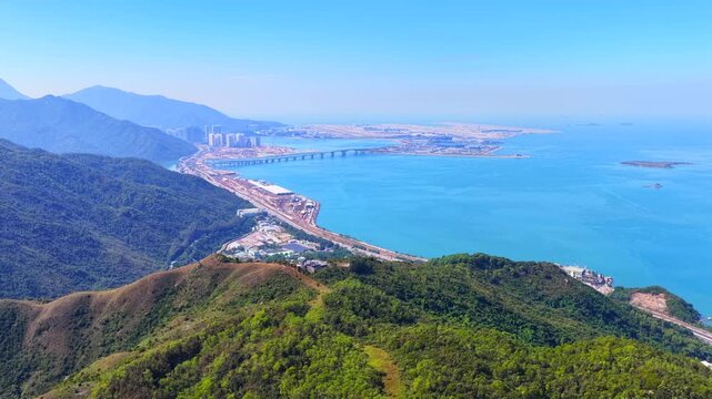 Skyview of lantau island siu ho wan tung chung new town and hong kong zhuhai macau bridge artificial island near chek lap kok airport showcasing greater bay area logistics growth