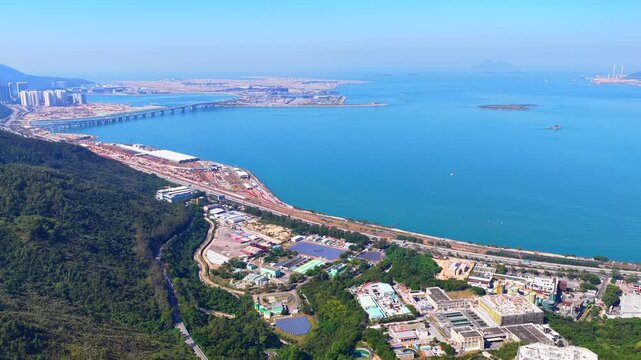 Skyview of lantau island siu ho wan tung chung new town and hong kong zhuhai macau bridge artificial island near chek lap kok airport showcasing greater bay area logistics growth