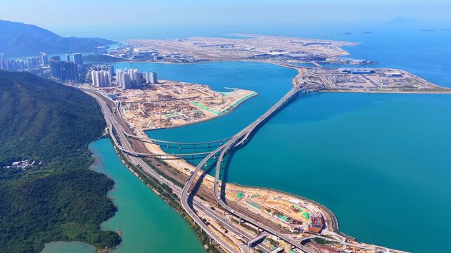 Skyview of lantau island siu ho wan tung chung new town and hong kong zhuhai macau bridge artificial island near chek lap kok airport showcasing greater bay area logistics growth