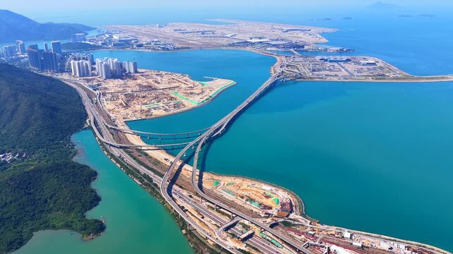 Skyview of lantau island siu ho wan tung chung new town and hong kong zhuhai macau bridge artificial island near chek lap kok airport showcasing greater bay area logistics growth