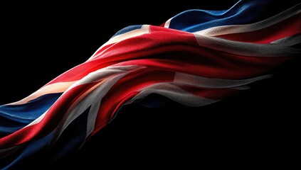 Rippling Union Jack flag against a stark black background, symbolizing national pride