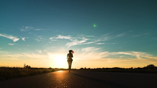 silhouette sports girl running legs along road sunset, cardio wellness, runner training, preparing races, fit athletic girl runs dawn, outdoors, sportswoman morning jogging, professional runner