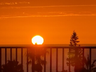 A tight close-up of the sun as it touches the horizon during a Pacific sunset in La Jolla. © Bryan Lambert