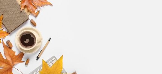 Cup of coffee, computer keyboard, notebooks, autumn leaves and acorns on white background with space for text, top view © Pixel-Shot