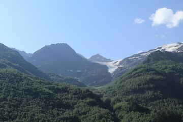 Naklejka premium Mountain landscape of the North Caucasus mountains near Mount Elbrus on a sunny summer day