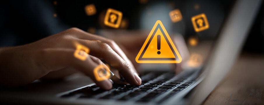 Cyber security warning icon alert on laptop data risk online protection concept shows digital safety concern