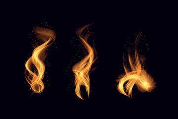 Fototapeta premium Three orange flames on a black background with sparks flying