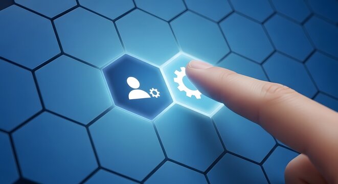 Finger touching a glowing gear on a blue hexagonal grid