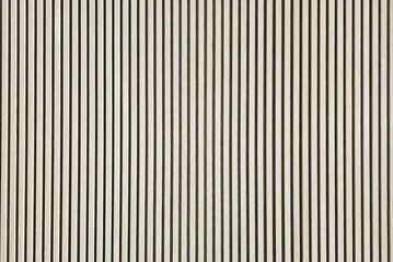 Wood Slat Wall Panels feature elegant fluted wood strips mounted on a felt acoustic backer to reduce sound.