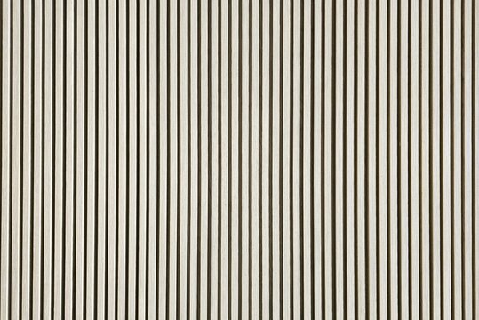 Wood Slat Wall Panels feature elegant fluted wood strips mounted on a felt acoustic backer to reduce sound.