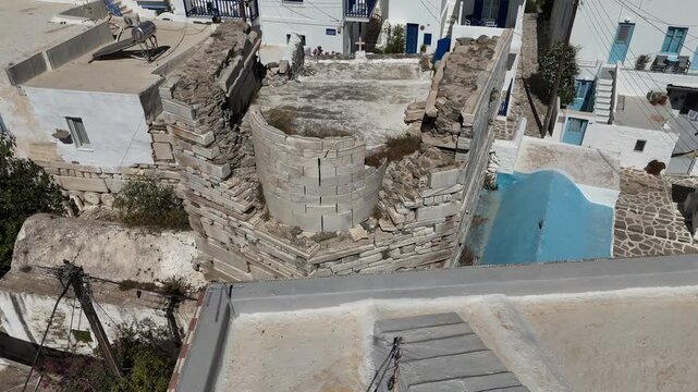 Cyclades,Paros Island,Aerial view half circle pan right around traditional settlement and Frankish Castle of Paroikia with unique Cycladic architecture at Greece.