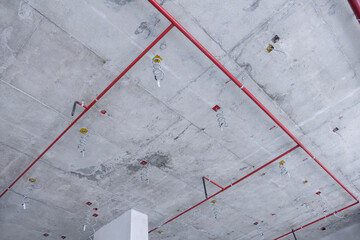 Public utilities within the construction of large buildings, such as electrical systems, fire hydrants in ceiling frames.  © noppadon