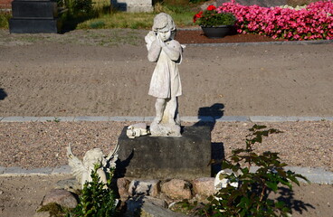 Sculpture on the Cemetey in the Village H&auml;uslingen, Lower Saxony