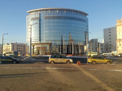 Modern glass building of the Faculty of International Relations of Belarusian State University at Railway Station square on a sunny winter day in Minsk, 2014 
