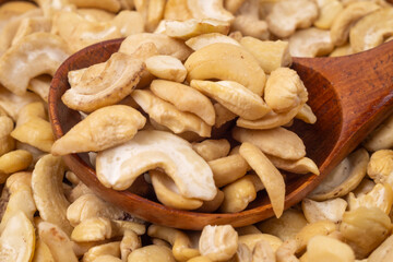 Fototapeta premium Cashew and wooden spoon,close-up