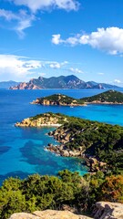 Obraz premium A serene coastal landscape with turquoise waters and lush green islands