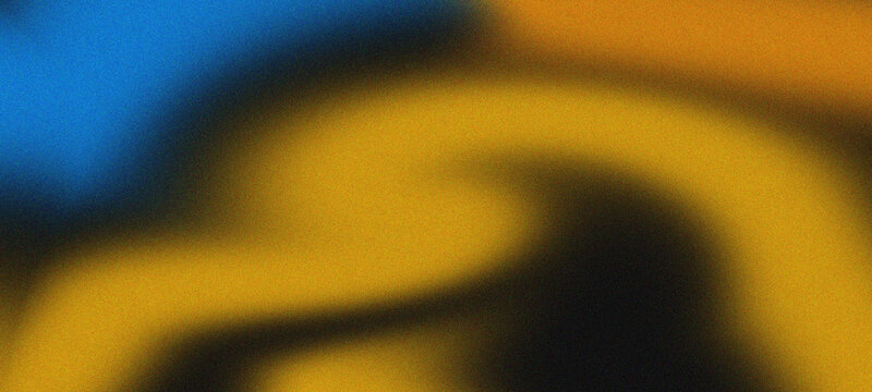 A blurry image with blue and yellow colors