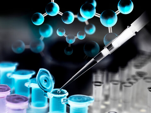 A chemical sample being pipetted into a eppendorf tube with a chemical compound in the background