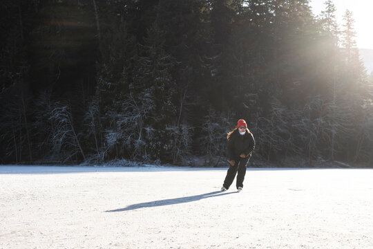 Figure Skater Practicing on Outdoor Ice