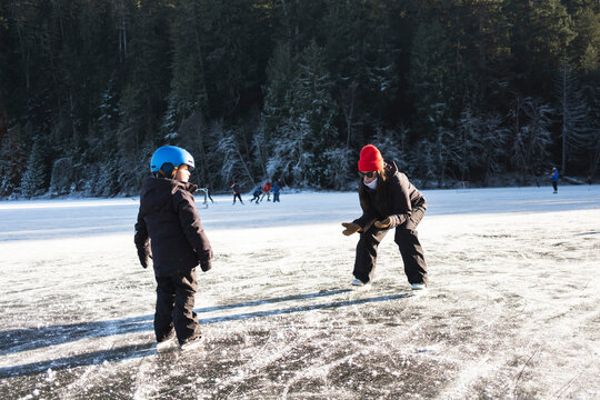 Child Learning to Ice Skate in Winter in Canada