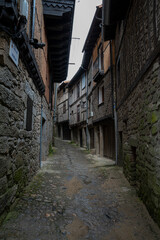 Fototapeta premium Narrow cobblestone street with stone buildings.. La Alberca, in the province of Salamanca, Spain