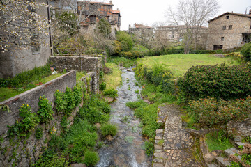 Fototapeta premium A serene stream flowing through a green landscape.. La Alberca, in the province of Salamanca, Spain
