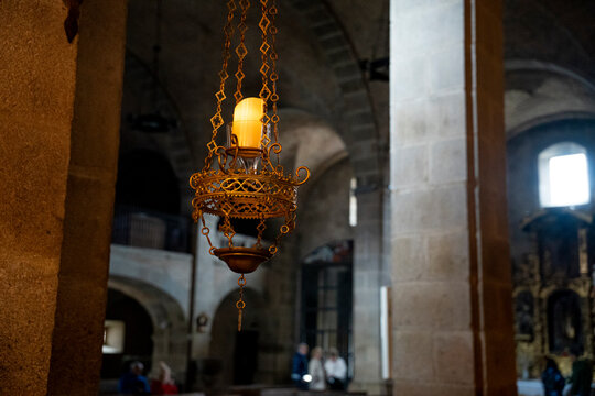 Hanging lantern inside a historic church interior.. Parish Church of Our Lady of the Assumption in La Alberca, Salamanca, Spain