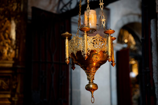 Ornate chandelier hanging in a church interior.. Parish Church of Our Lady of the Assumption in La Alberca, Salamanca, Spain