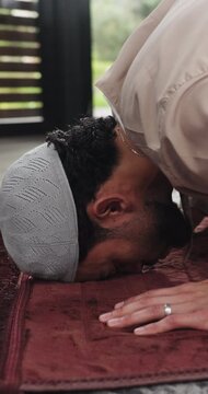 Home, prayer and bow with muslim man for faith, worship and praise Allah for gratitude. Islam, spiritual and person prostrate for praying, dua and salah for holy religion with peace on Ramadan Kareem