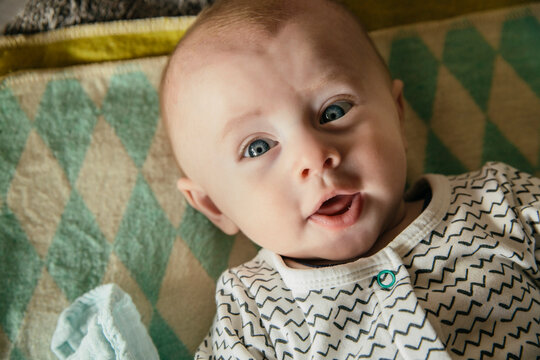 Happy baby face as seen from above