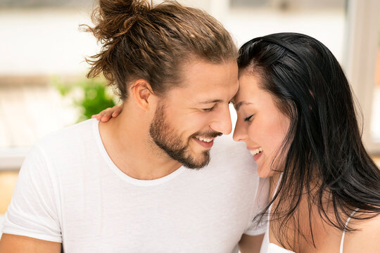 Affectionate couple kissing, portrait
