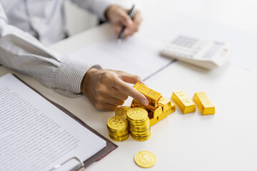 Gold bar Trading business people hand offering gold&nbsp;Investment in gold mining company or Trading gold on the stock exchange&nbsp;Rising prices.