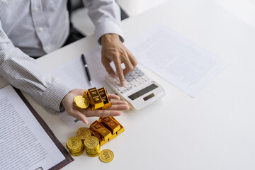 Gold bar Trading business people hand offering gold&nbsp;Investment in gold mining company or Trading gold on the stock exchange&nbsp;Rising prices.