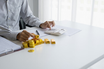 Gold bar Trading business people hand offering gold&nbsp;Investment in gold mining company or Trading gold on the stock exchange&nbsp;Rising prices.