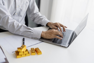 Gold bar Trading business people hand offering gold&nbsp;Investment in gold mining company or Trading gold on the stock exchange&nbsp;Rising prices.