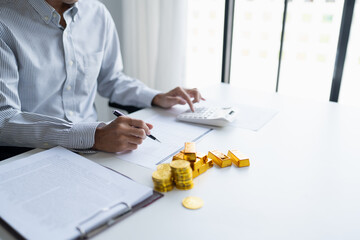 Gold bar Trading business people hand offering gold&nbsp;Investment in gold mining company or Trading gold on the stock exchange&nbsp;Rising prices.