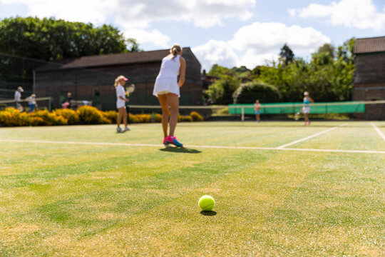 Mature women during a tennis match on grass court