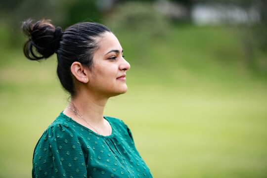Side profile of an Indian woman looking forward