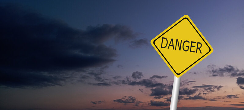 Hurricane Idalia warning sign against a powerful stormy background with copy space. Dirty and angled sign with cyclonic winds add to the drama.hurricane season sign on cloudy background