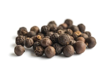 Pile of black peppercorns on white background for culinary use