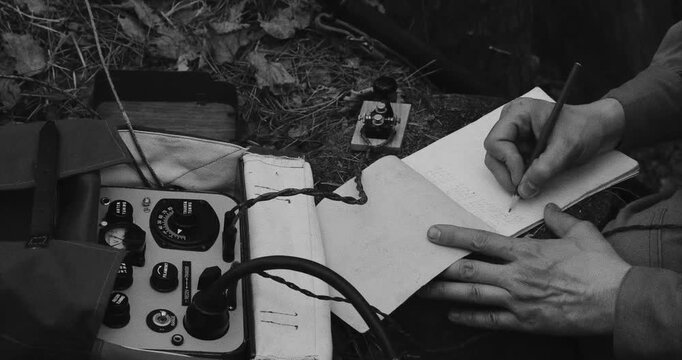 Nature's Whisper: Vintage Listening Equipment and Notes Black And White Video. Russian Soviet Infantry Red Army Soldier In World War II using Russian Soviet Portable Radio Transceiver In Trench