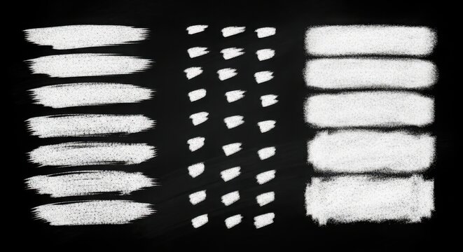 Set of chalk brush strokes and paint smudges on black background, perfect for grunge textures and artistic design elements.