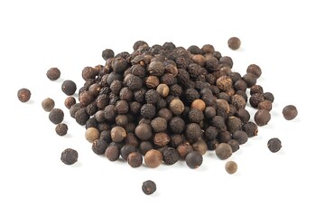 Pile of black peppercorns on white background for culinary use