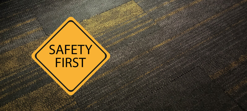 Safety first symbols, work safety, caution work hazards, danger surveillance, zero accident concept. Wooden cubes with smart grey background. Employees safety awareness at workplace. Safety banner.	

