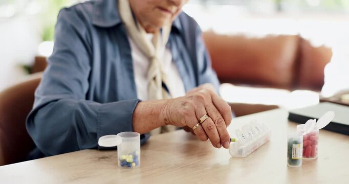 Hands, old woman and organize pills at house for daily dosage, medicine routine and prescription. Senior person, tablets and container for weekly planner, pharmaceutical reminder and chronic illness