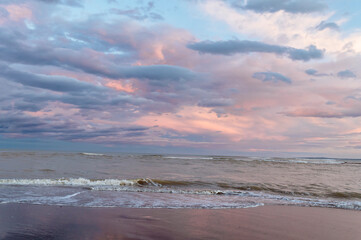 Fototapeta premium Plastic Pollution on Beach at Sunset – Environmental Damage and Climate Change Concept