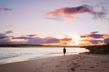 Naklejka premium Plastic Pollution on Beach at Sunset – Environmental Damage and Climate Change Concept